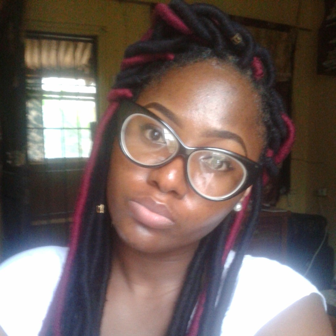 Olaedo in red and black faux yarn locs